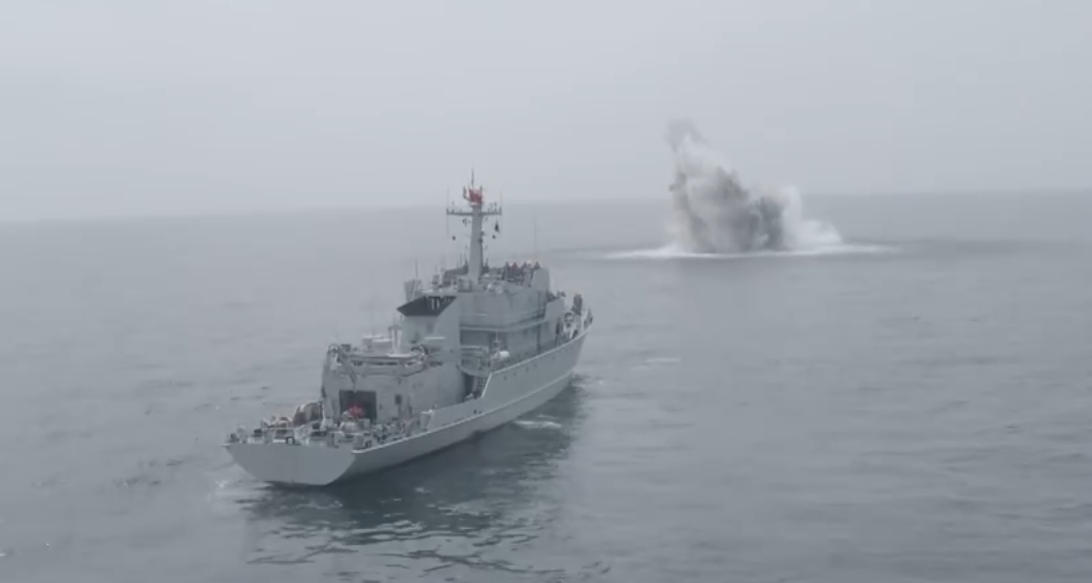An unmanned submarine detonates a naval mine, clearing the way for a crewed vessel. /CMG