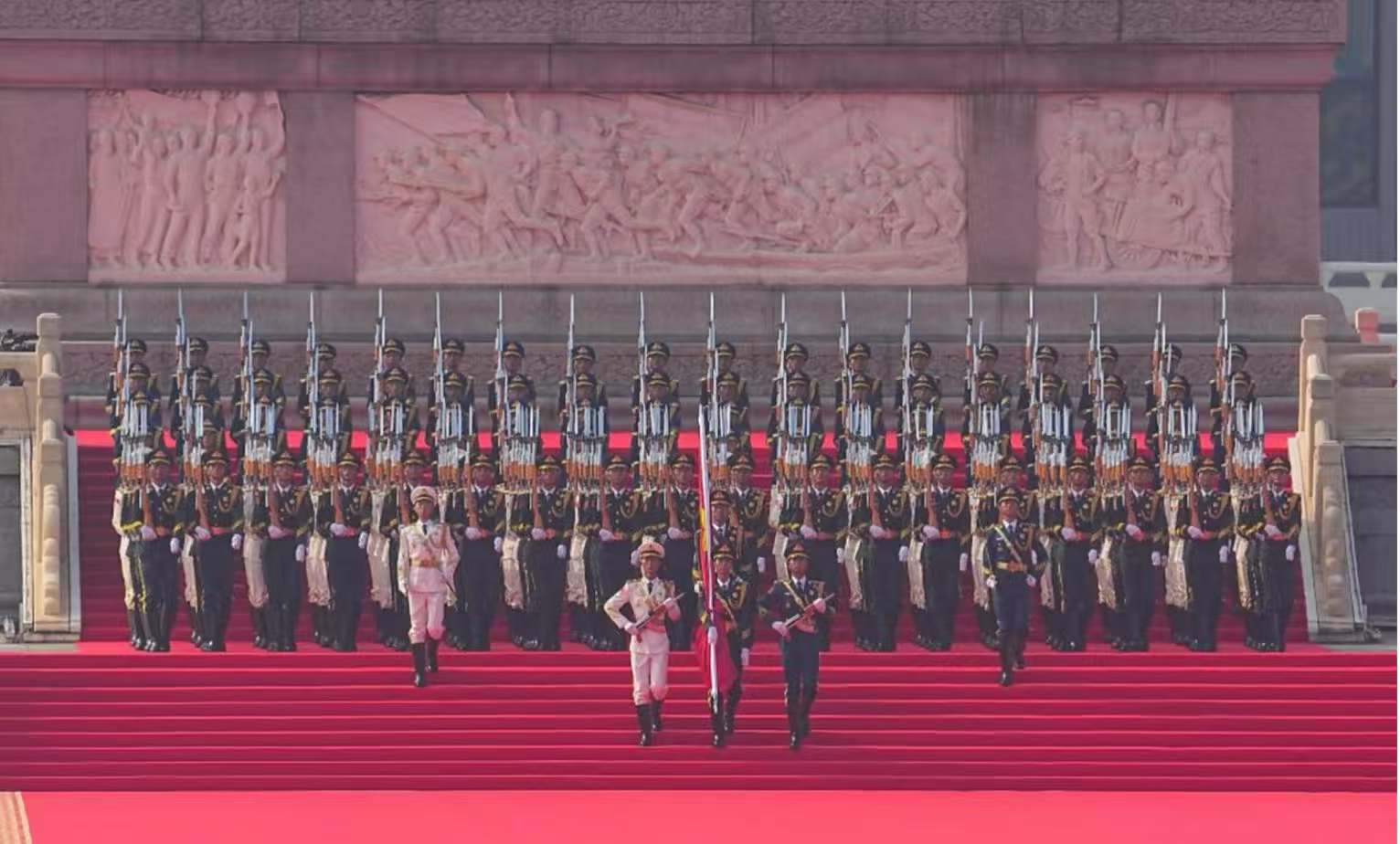 Soldiers escort the Chinese national flag for a flag-raising ceremony during a grand gathering to commemorate the 80th anniversary of the victory in the Chinese People's War of Resistance Against Japanese Aggression and the World Anti-Fascist War in Beijing, capital of China, September 3, 2025. /Xinhua