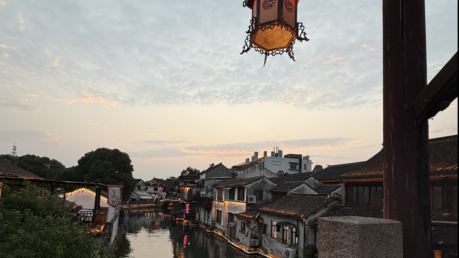 A sweeping view reveals canals and tiled rooftops of Tongli Water Town, Jiangsu Province. /Zaruhi Poghosyan
