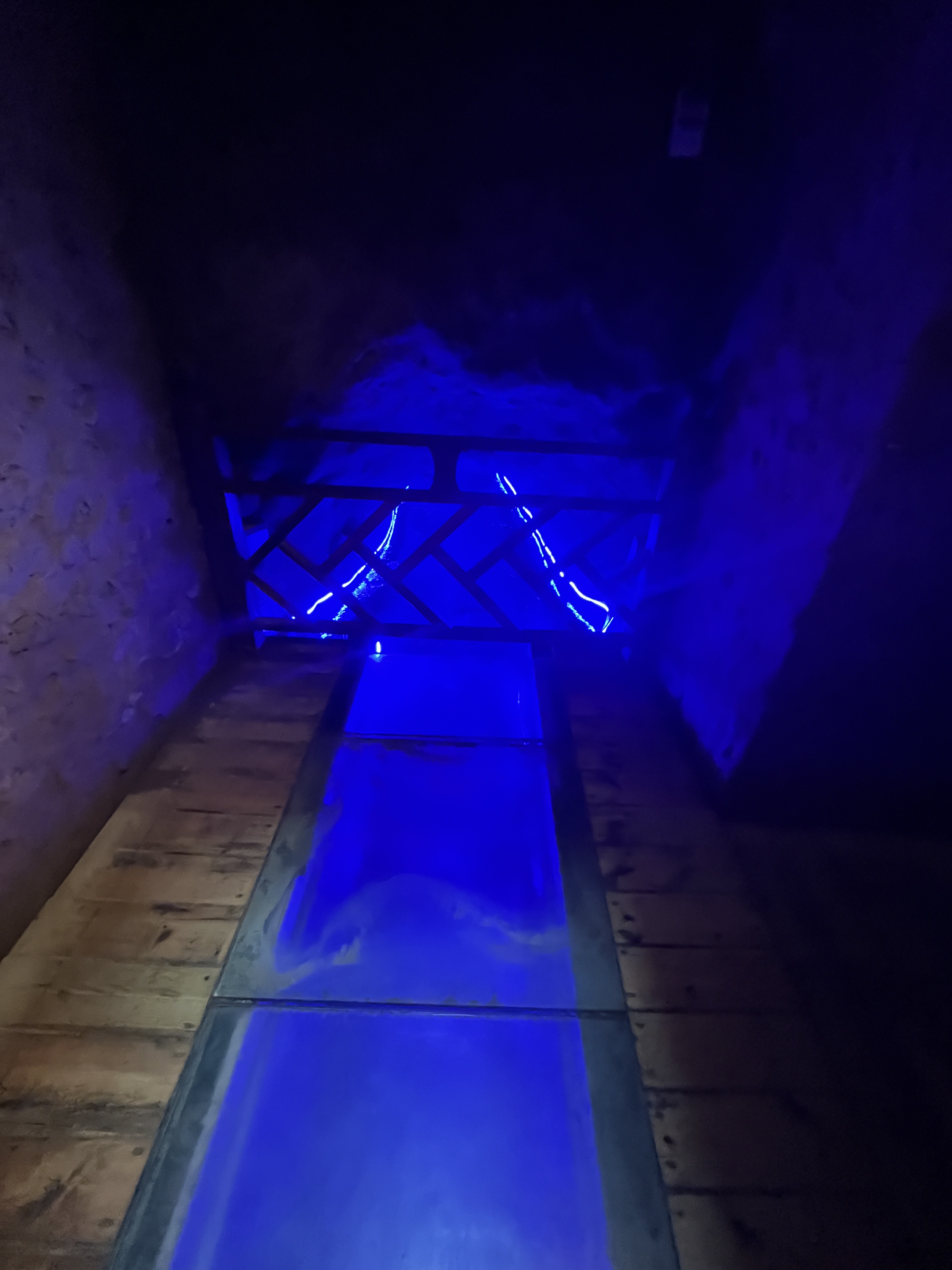 An underground karez channel is lit up at the Turpan Karez Paradise museum in Xinjiang. / CGTN