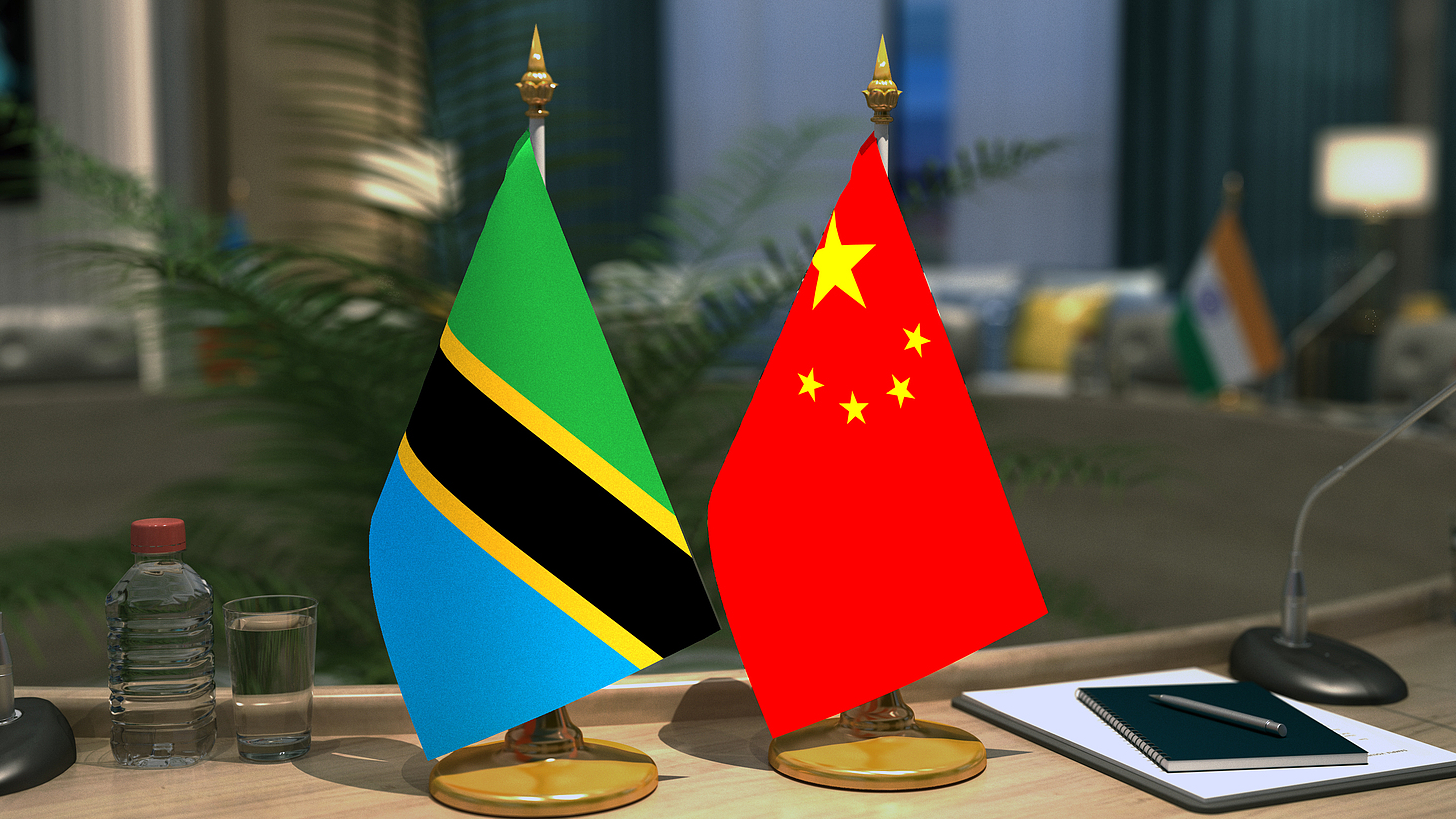 The national flag of China (R) and the national flag of Tanzania. /VCG