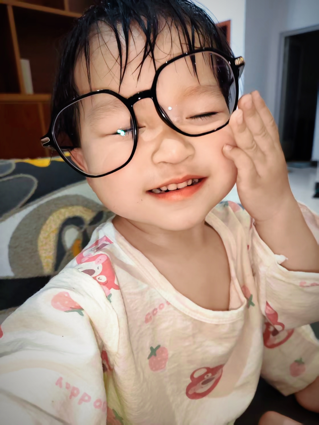 First Glimpse of the World: The camera freezes a moment: a child wearing oversized glasses, beams with a sweet smile on the sofa. Their innocent face brimming with the wonder of their first encounter with the world.
This scene resonates with the UN Sustainable Development Goals of 