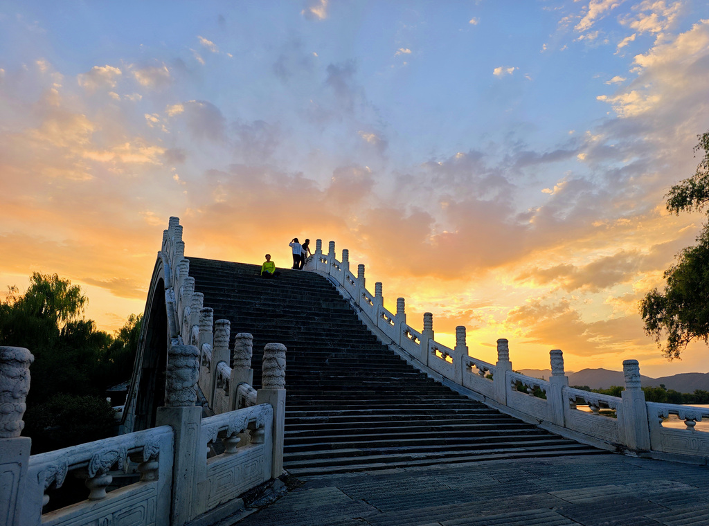 A stunning sunset glow lights up the evening sky at the Summer Palace in Beijing on September 8, 2025. /VCG