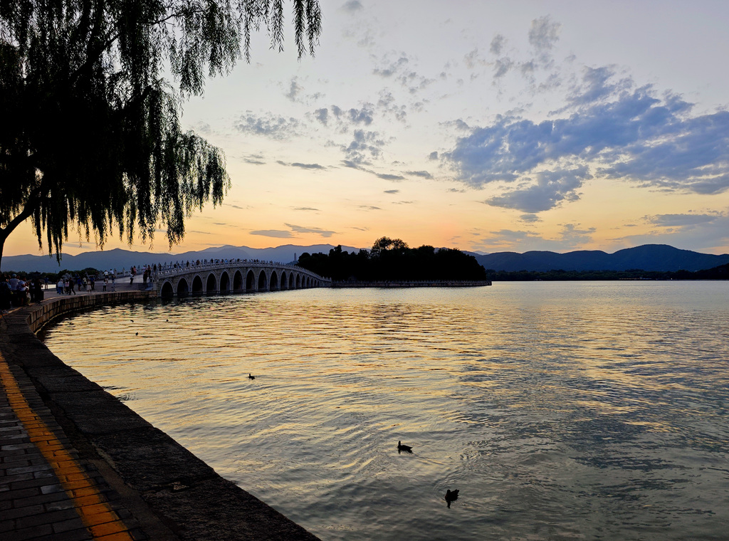 A stunning sunset glow lights up the evening sky at the Summer Palace in Beijing on September 8, 2025. /VCG