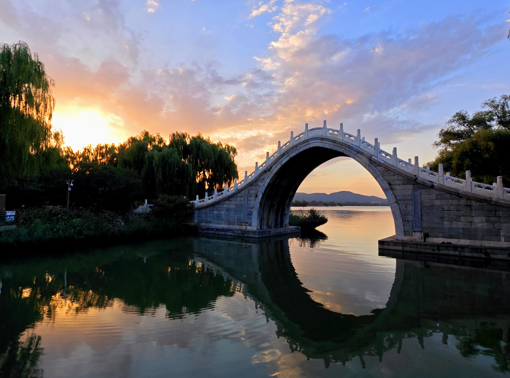 A stunning sunset glow lights up the evening sky at the Summer Palace in Beijing on September 8, 2025. /VCG