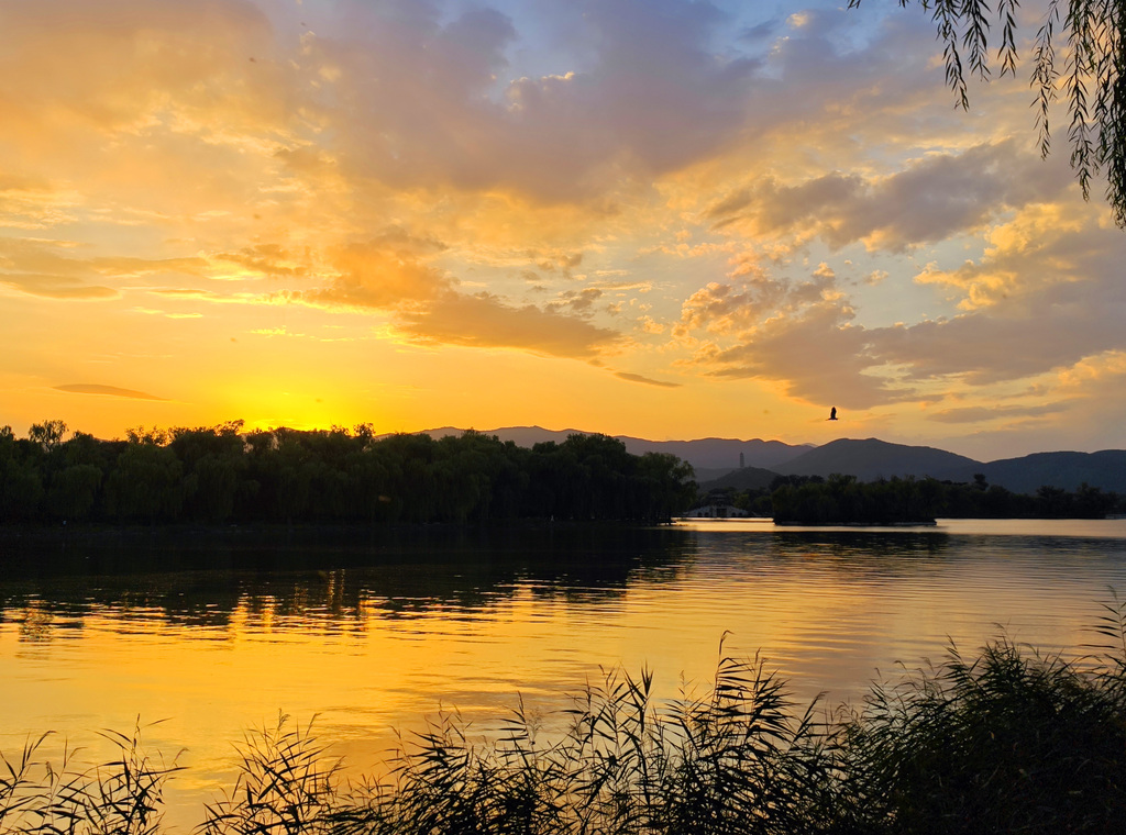 A stunning sunset glow lights up the evening sky at the Summer Palace in Beijing on September 8, 2025. /VCG