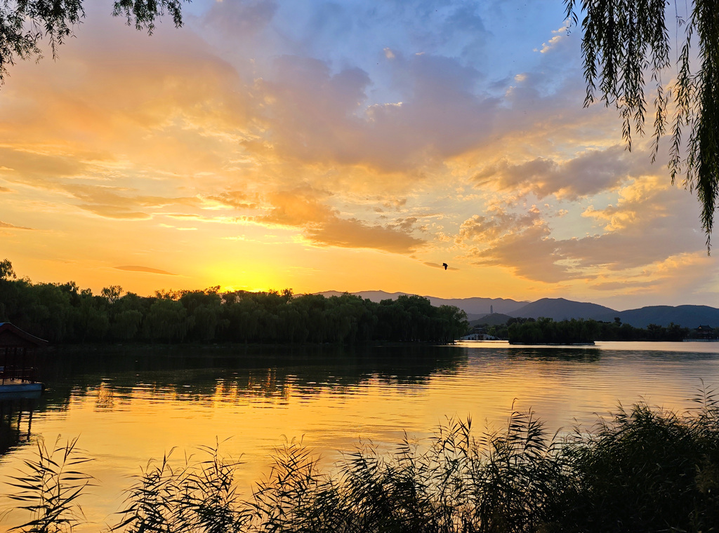 A stunning sunset glow lights up the evening sky at the Summer Palace in Beijing on September 8, 2025. /VCG