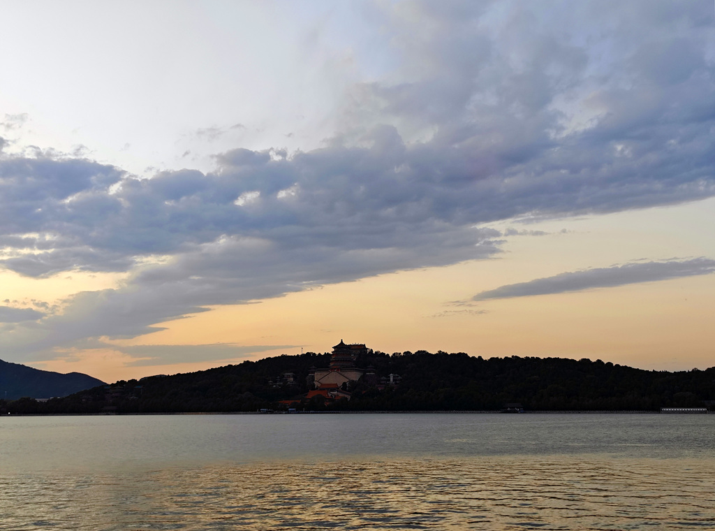 A stunning sunset glow lights up the evening sky at the Summer Palace in Beijing on September 8, 2025. /VCG