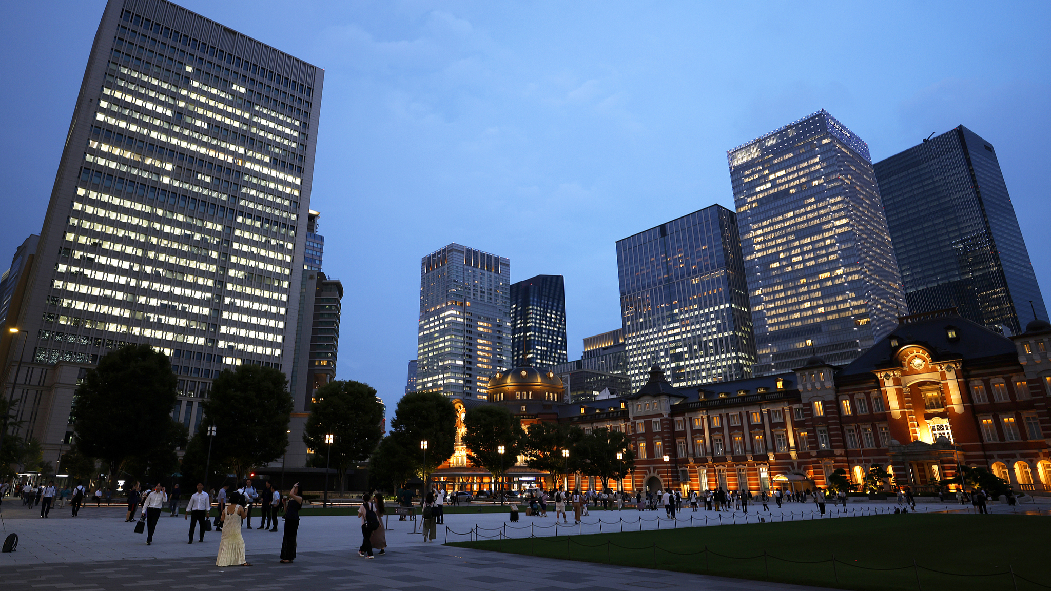 Illuminated Tokyo station and the neighboring buildings at dusk in Tokyo, Japan, on September 8, 2025. /VCG