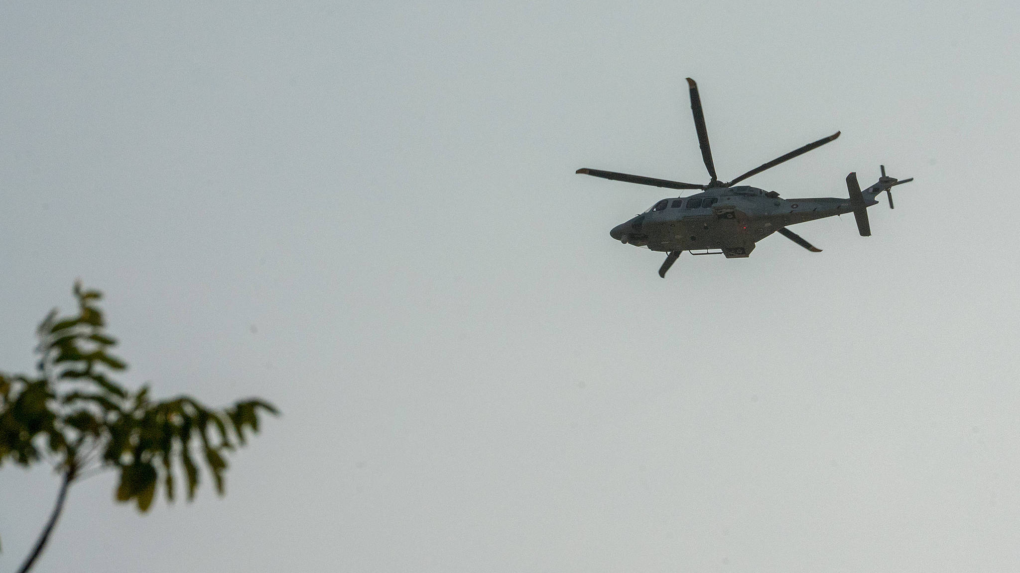 A helicopter is seen flying over the site of the Israeli airstrike in Doha, Qatar, September 9, 2025. /VCG