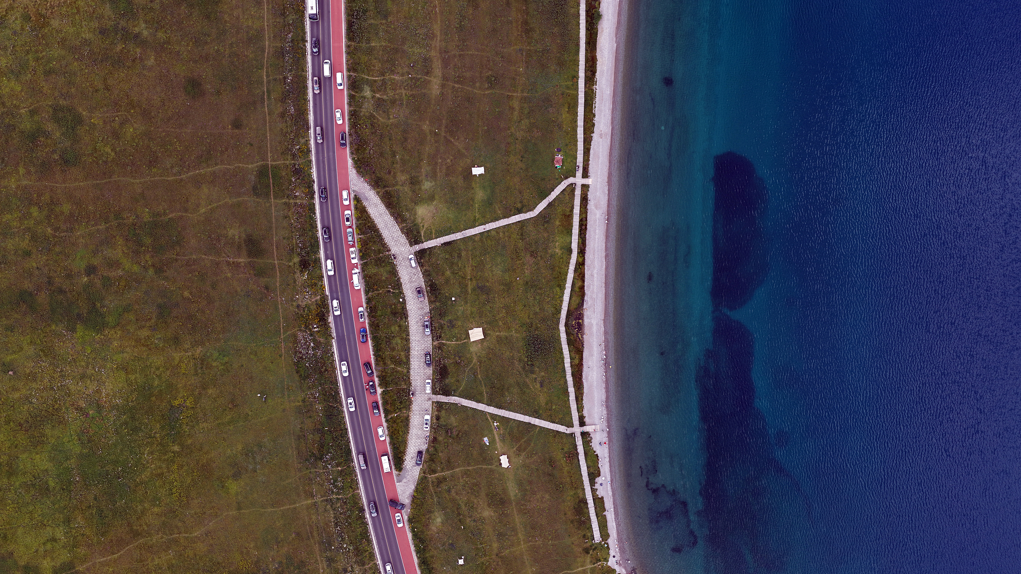 An aerial view of Sayram Lake, Xinjiang's highest and largest alpine lake, July 18, 2025. /VCG