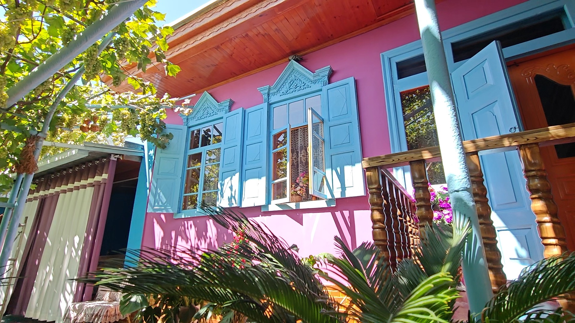 Purple walls and bright blue windows inside a Uygur courtyard in Kazanqi culture tourism area in Yining City, August 19, 2025. /CGTN's Wang Yungang