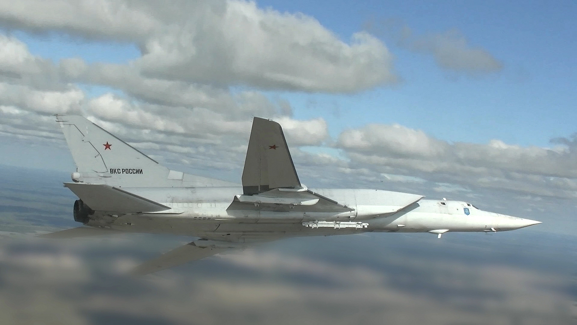 In this handout video grab released by the Russian Defense Ministry, a Tupolev Tu-22M3 strategic bomber flies during the Russian-Belarusian joint military drills 