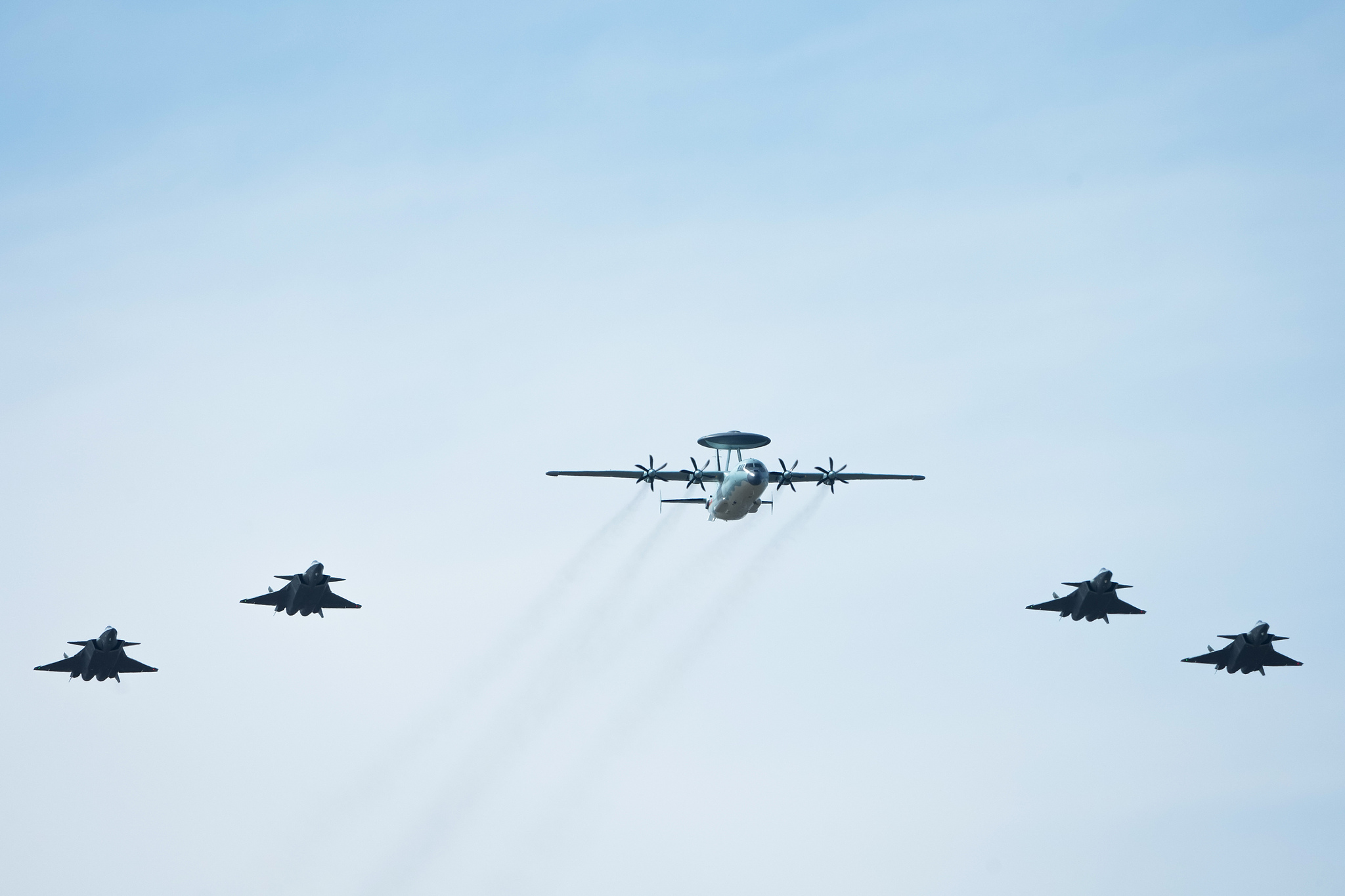 A KJ-500 is escorted by a J-20 formation at the Changchun Air Show, Jilin Province, northeast China, September 19, 2025. /VCG