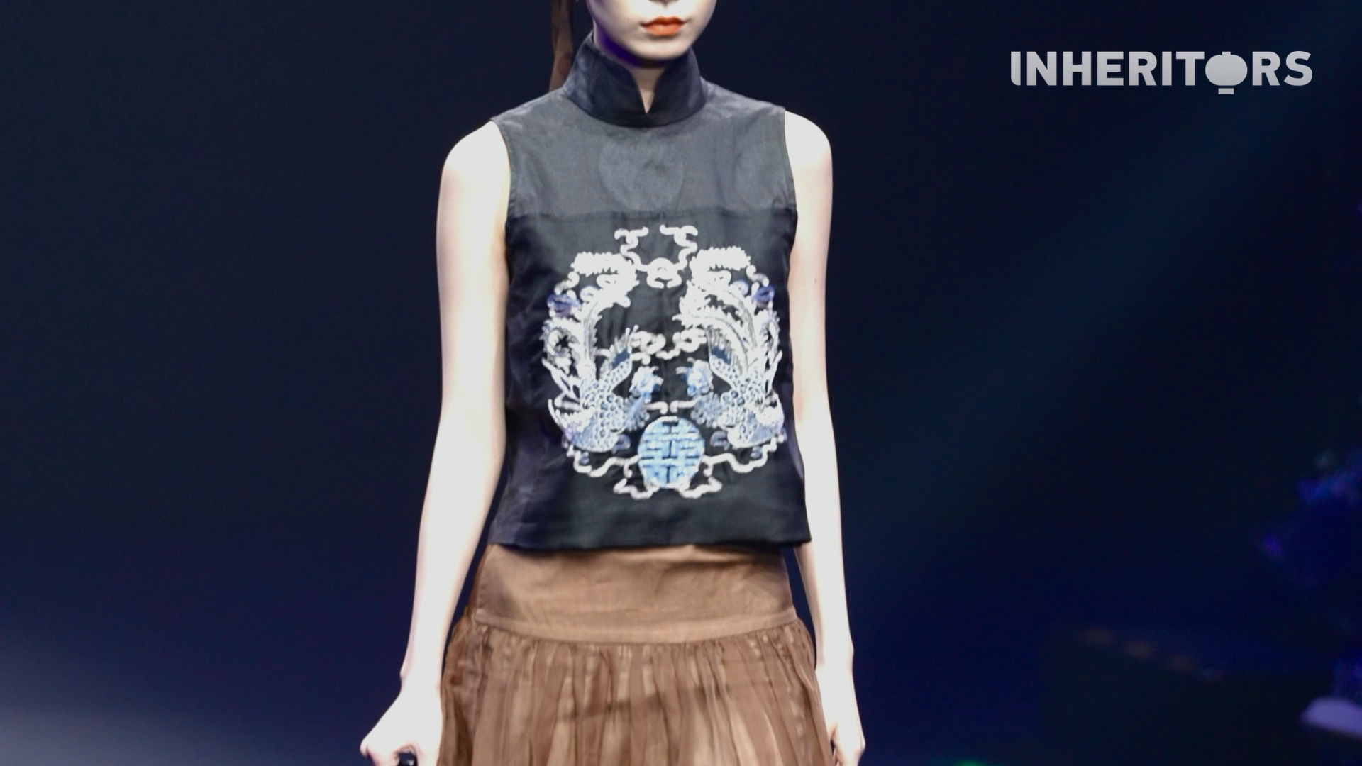 Miao embroidery, reimagined with AI and big data, blends traditional stitching with silver ornaments to create designs that are both timeless and new. /CGTN