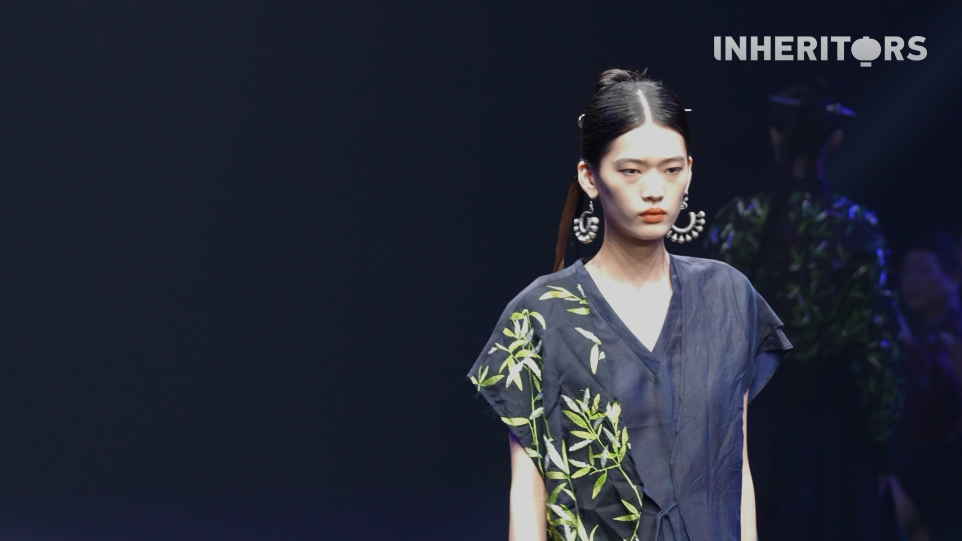 Miao embroidery, reimagined with AI and big data, blends traditional stitching with silver ornaments to create designs that are both timeless and new. /CGTN