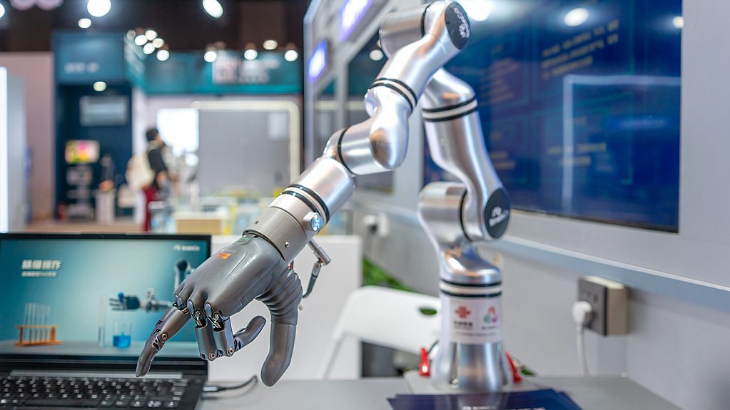 An intelligent robotic arm and intelligent bionic hand displayed at an AI-themed product and service launch event held in Guangdong Province, China, September 20, 2025. /VCG