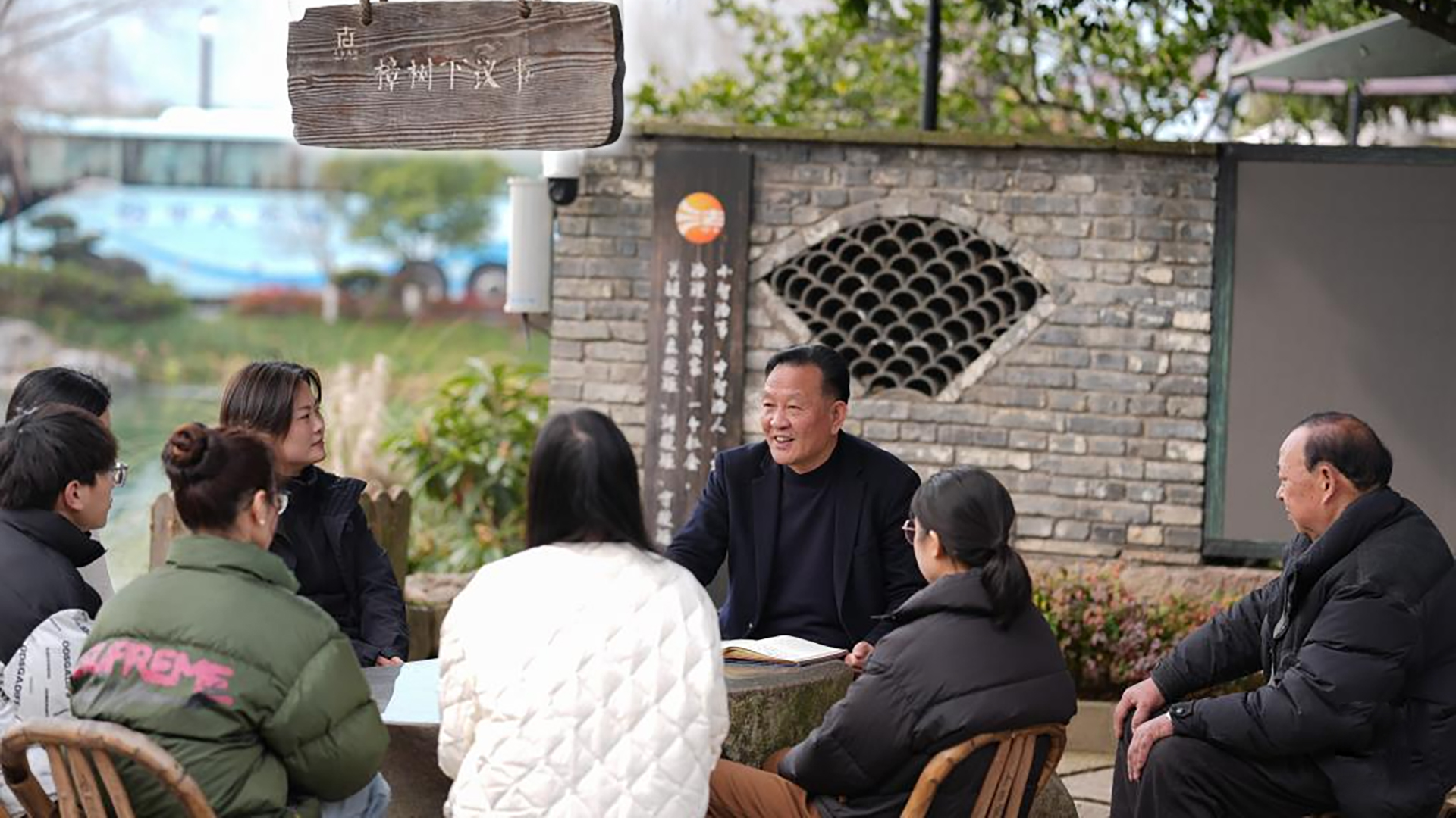 Lin Guorong (3rd R) holds a discussion with local officials and villagers in Xiaogucheng Village of Yuhang District in Hangzhou, east China's Zhejiang Province, February 26, 2025. /Xinhua