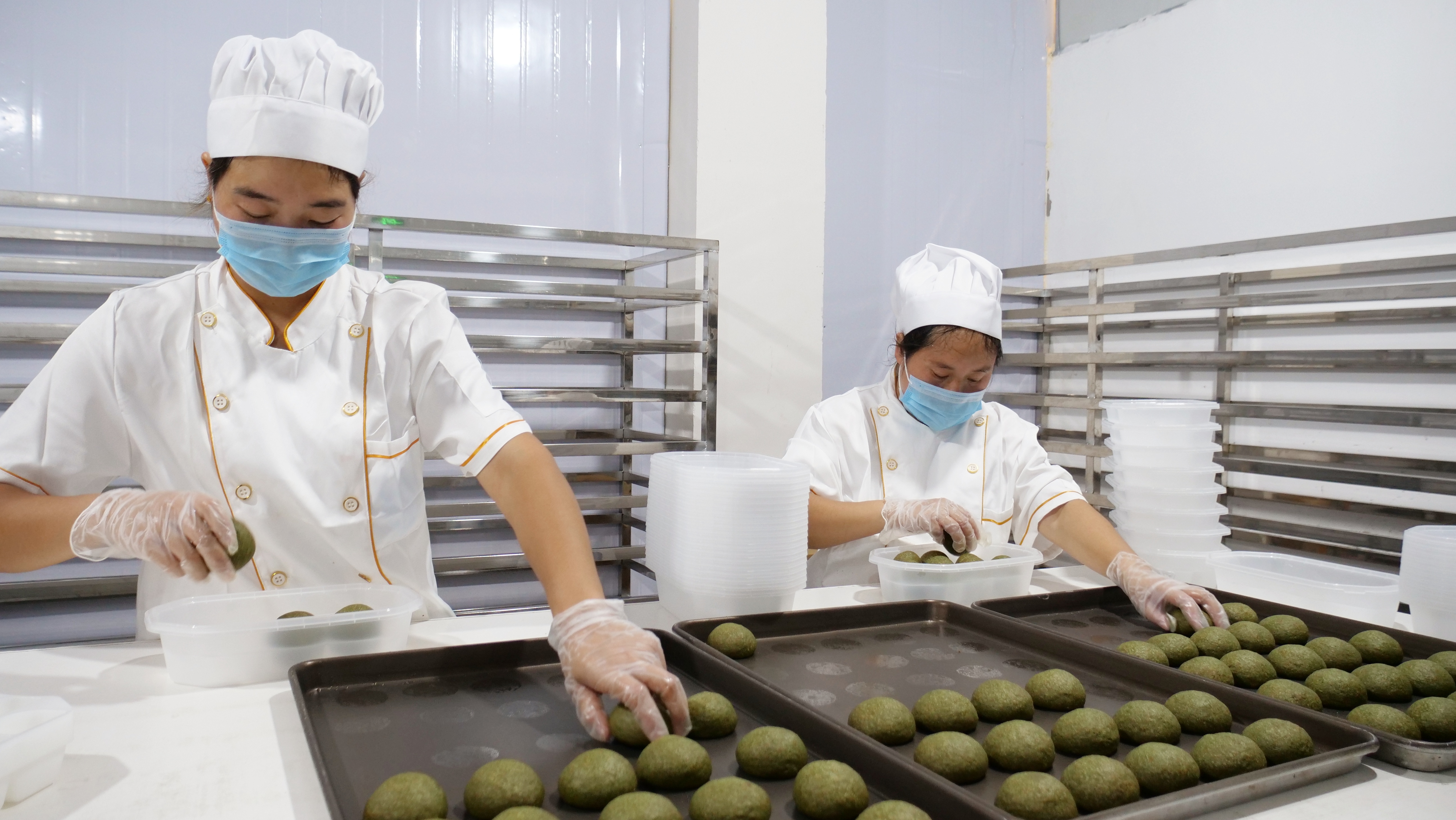 Workers make matcha mooncakes in Jiangkou County, southwest China's Guizhou Province, on September 3, 2025. /Photo provided to CGTNb