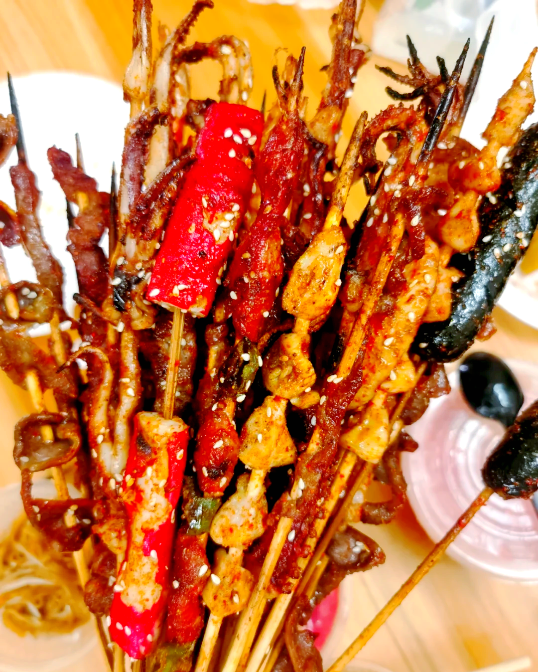 A variety of street delicacies are on offer at Xincun Night Market in Lingshui, Hainan Province. /Photo provided to CGTN