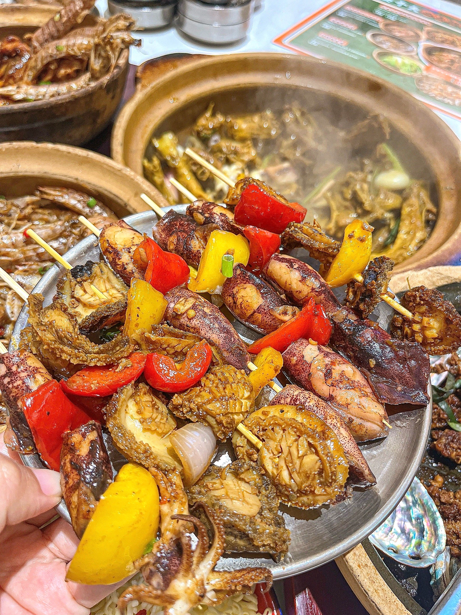 A variety of street delicacies are on offer at Xincun Night Market in Lingshui, Hainan Province. /Photo provided to CGTN