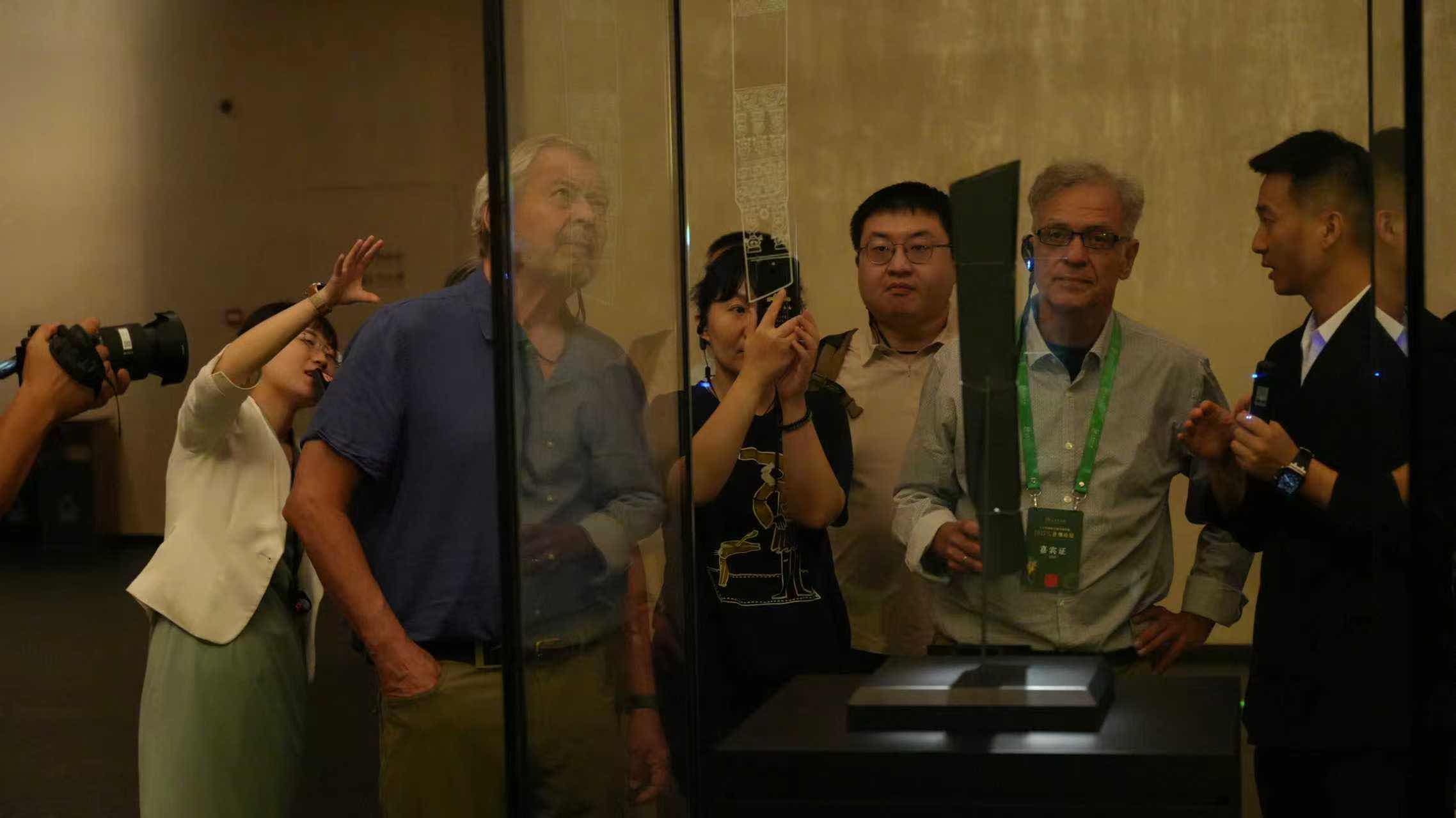 American (second from left) and Greek (second from right) archaeologists visit the Sanxingdui Museum in Guanghan, Sichuan Province, September 26, 2025. /CGTN