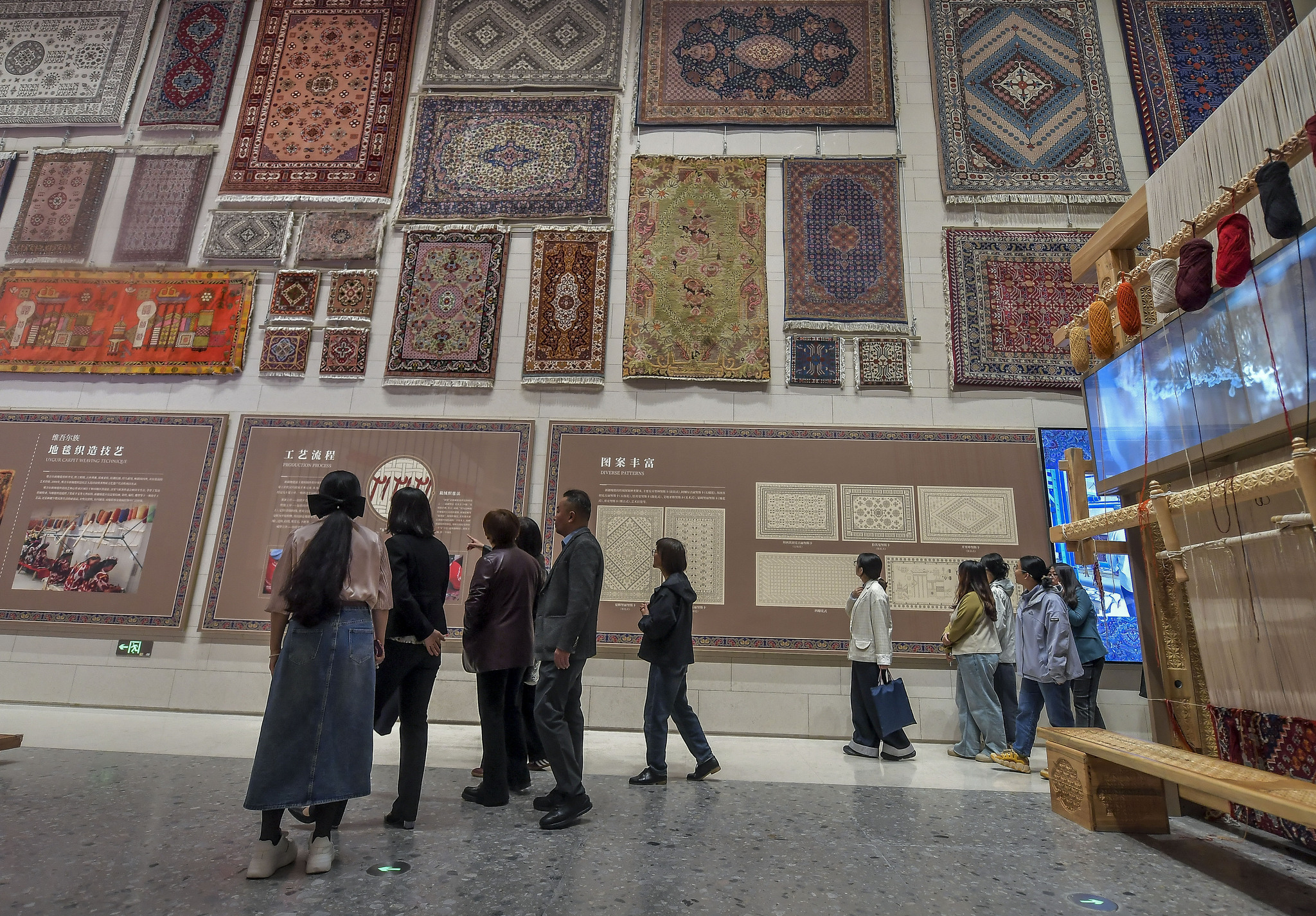 Visitors browse the Xinjiang Intangible Cultural Heritage Museum on September 26, 2025. /VCG