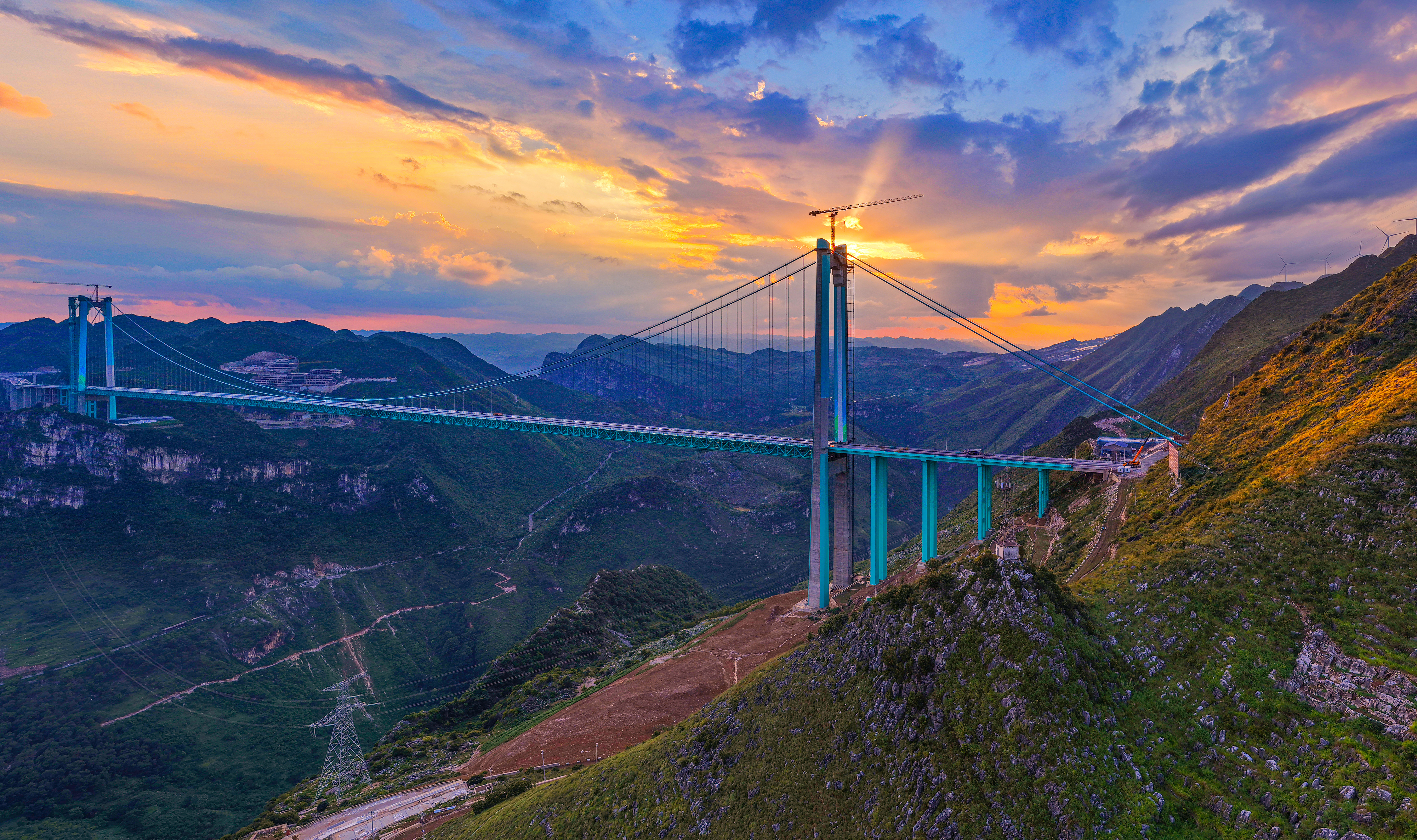 The Huajiang Grand Canyon Bridge at sunset, southwest China's Guizhou Province, August 9, 2025. /VCG