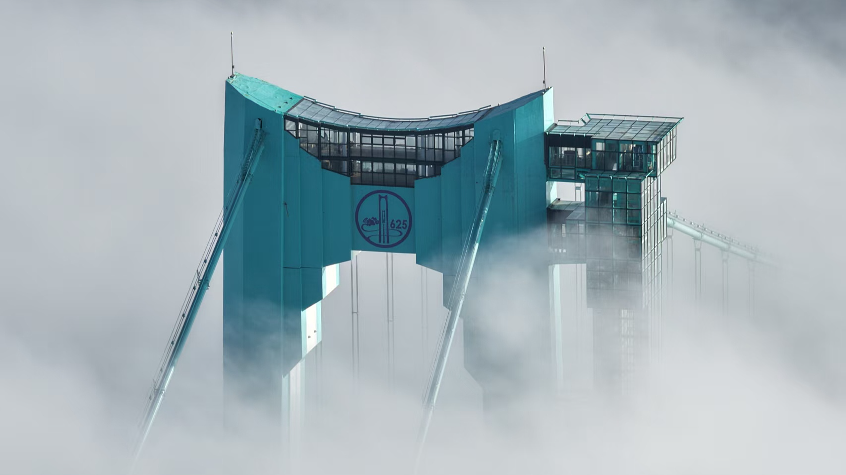 Mist adorns the exterior of the sky-high café atop the Huajiang Grand Canyon Bridge in southwest China's Guizhou Province, September 28, 2025. /VCG