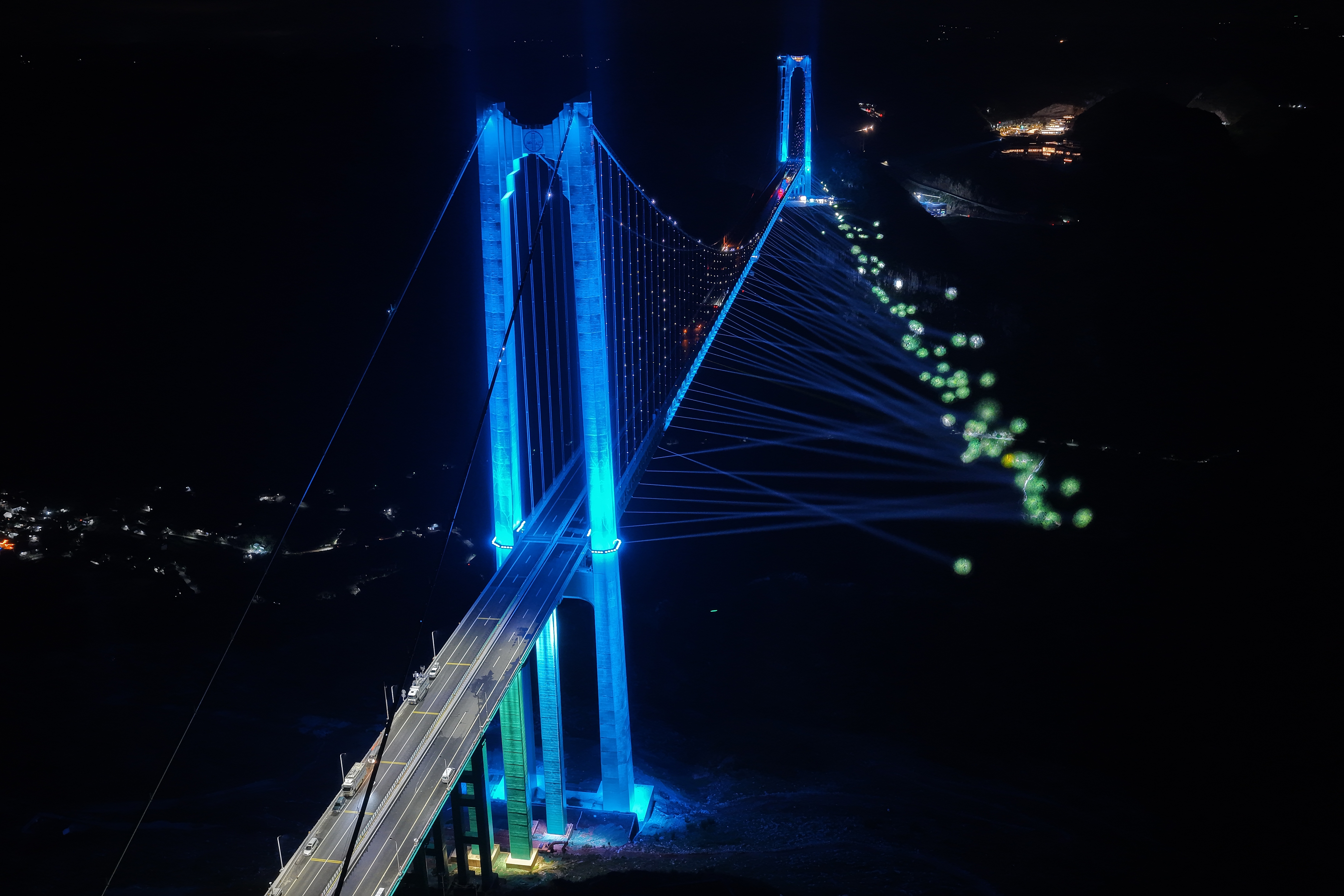 The Huajiang Grand Canyon Bridge dazzles at night, illuminated by brilliant lights, southwest China's Guizhou Province, September 27, 2025. /VCG