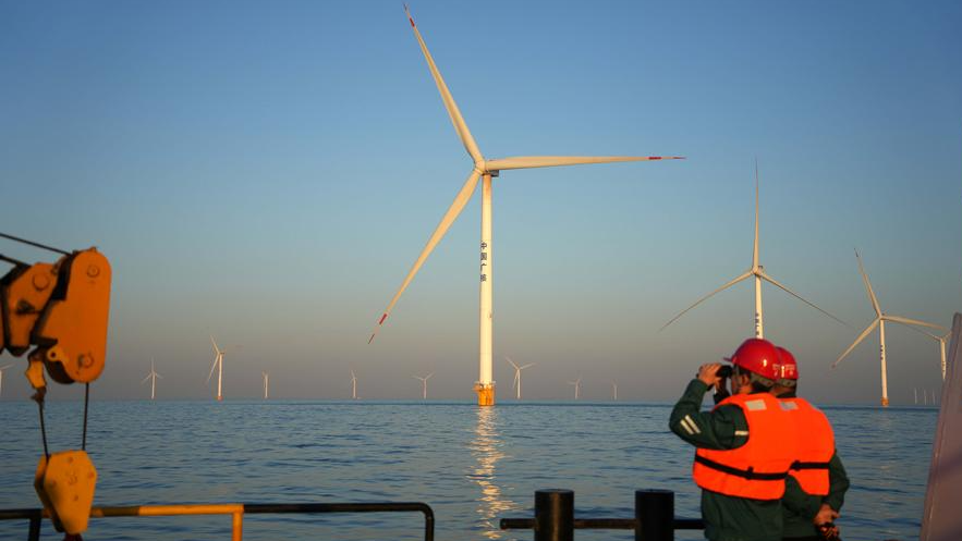 Offshore wind turbines are reflected in the waters of Laizhou City, east China's Shandong Province, January 7, 2025. /Xinhua