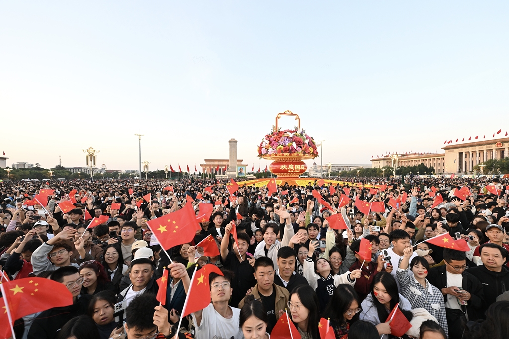 Crowds gather on the morning of October 1, 2025 for the flag-raising ceremony held at Beijing's Tiananmen Square to mark the 76th anniversary of the founding of the People's Republic of China. /VCG