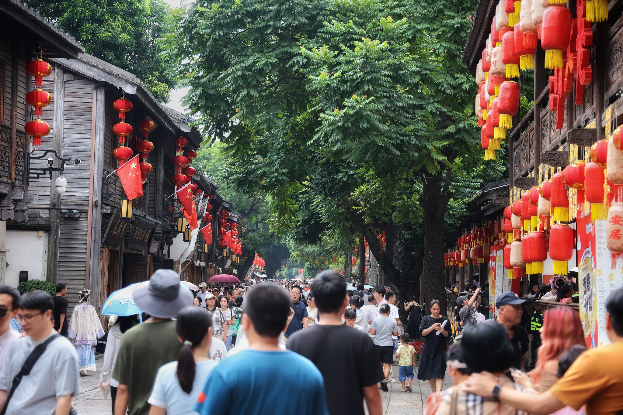 Tourists are seen at Sanfang Qixiang, a popular attraction in Fuzhou, southeast China's Fujian Province, October 1, 2025. /VCG