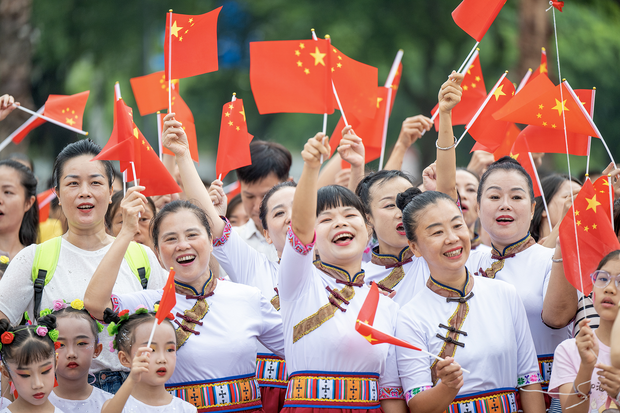 People attend a flag-raising ceremony marking the 76th anniversary of the founding of the People's Republic of China in Rongan County, south China's Guangxi Zhuang Autonomous Region, October 1, 2025. /VCG