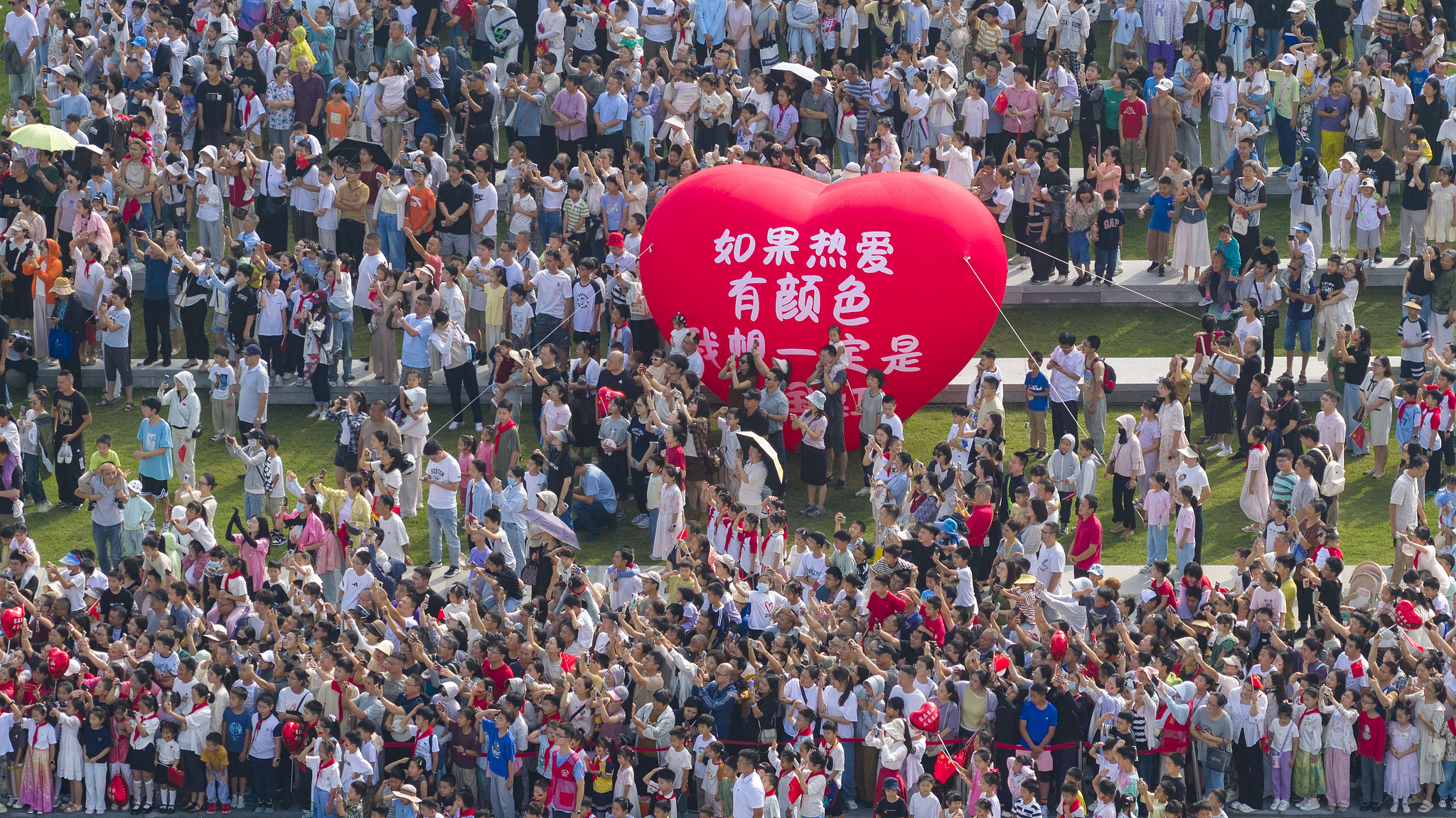 A flag-raising ceremony marking the 76th anniversary of the founding of the People's Republic of China is held in Kunshan, east China's Jiangsu Province, October 1, 2025. /VCG