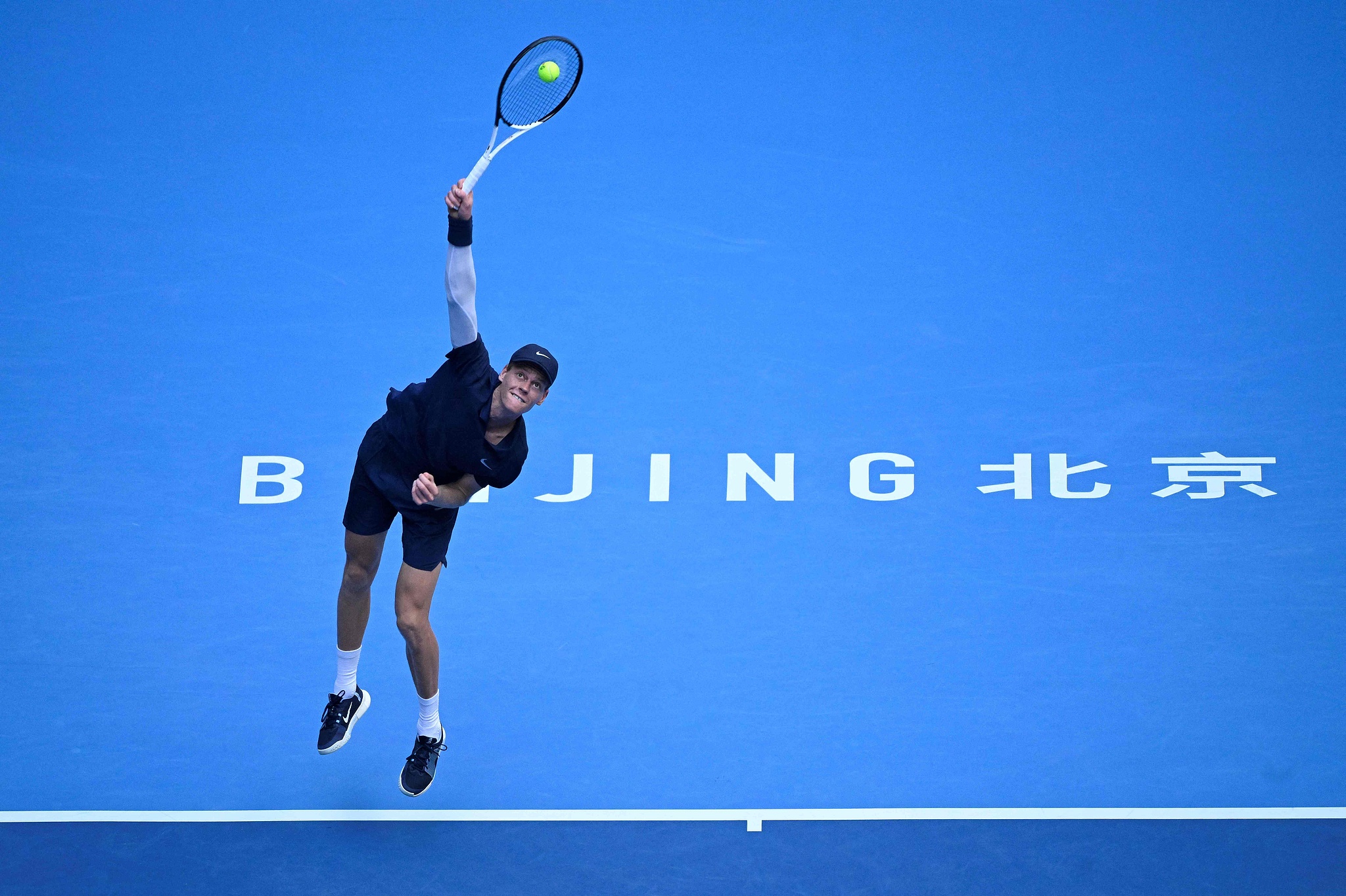 Italy's Jannik Sinner serves to Australia's Alex de Minaur during their men's singles semifinal match at the China Open in Beijing, China, September 30, 2025. /VCG