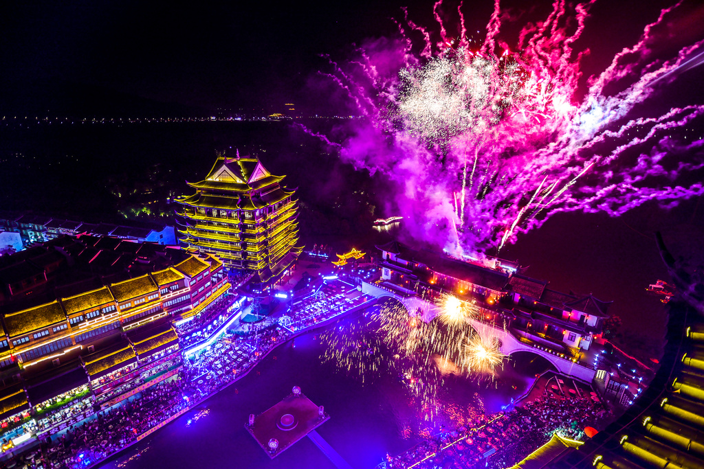 Fireworks burst above Taihu Ancient Town in Huzhou, Zhejiang Province on China's National Day, October 1, 2025. /VCG