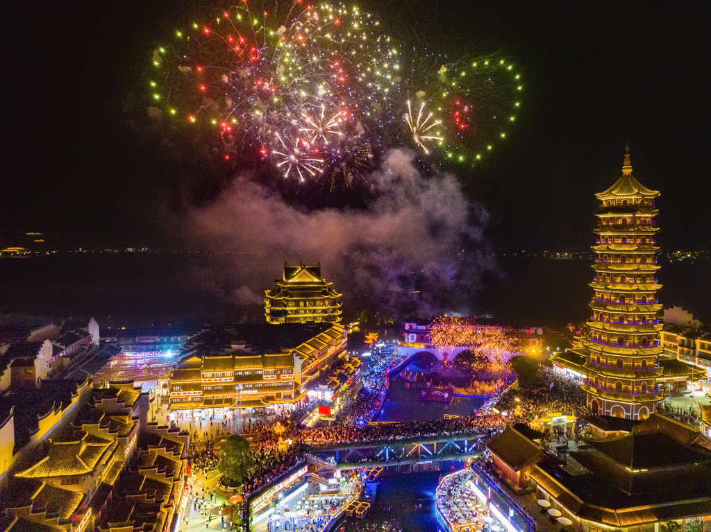 Fireworks burst above Taihu Ancient Town in Huzhou, Zhejiang Province on China's National Day, October 1, 2025. /VCG