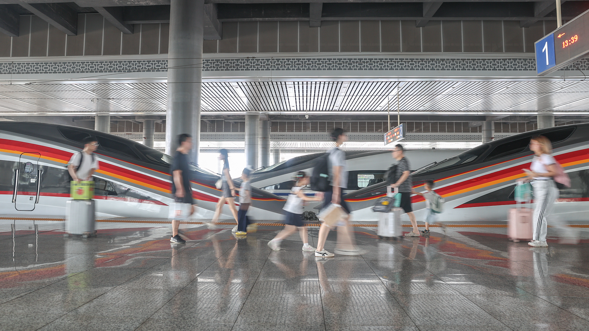 Passengers at a railway station in Ganzhou City, east China's Jiangxi Province, October 1, 2025. /VCG