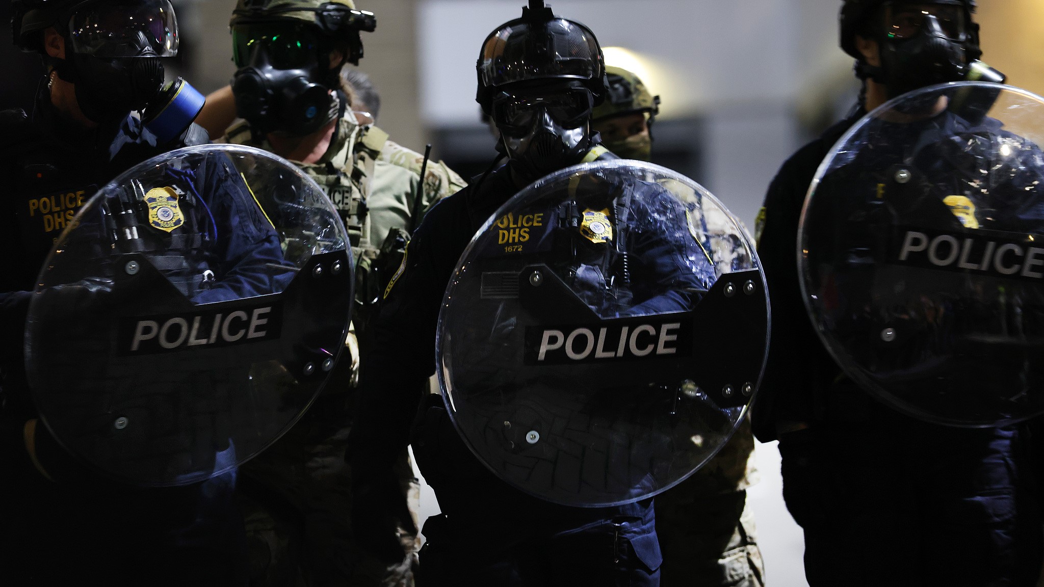 Federal agents, including members of the Department of Homeland Security and Border Patrol, hold back protesters outside a downtown U.S. Immigration and Customs Enforcement (ICE) facility in Portland, U.S., October 3, 2025. /VCG