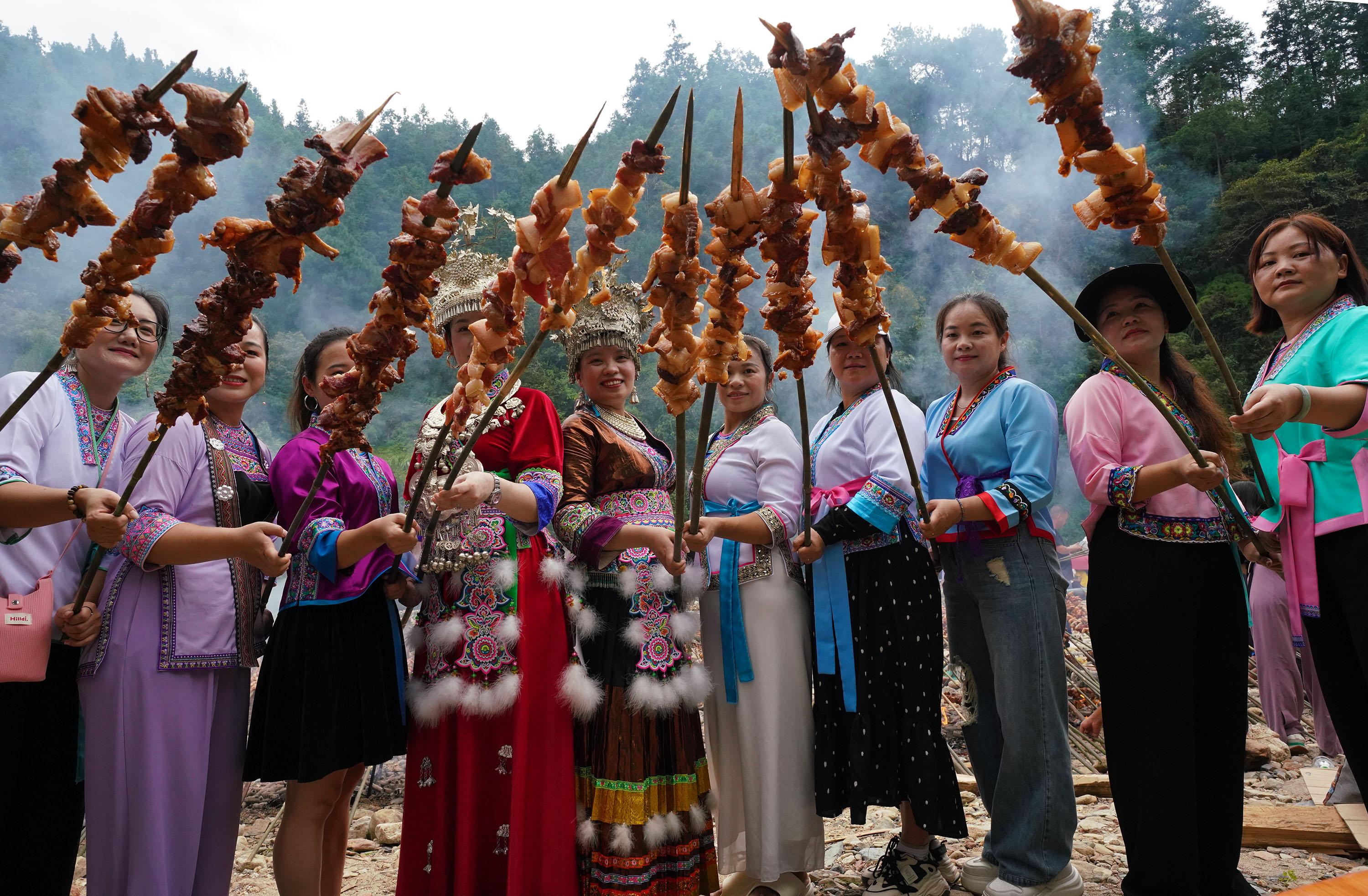 A barbecue party is held to celebrate the ongoing National Day holiday at Yuanbao Village, Rongshui Miao Autonomous County, south China's Guangxi Zhuang Autonomous Region, October 3, 2025. /IC