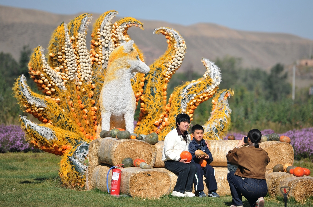 Visitors pose for photos inside the 