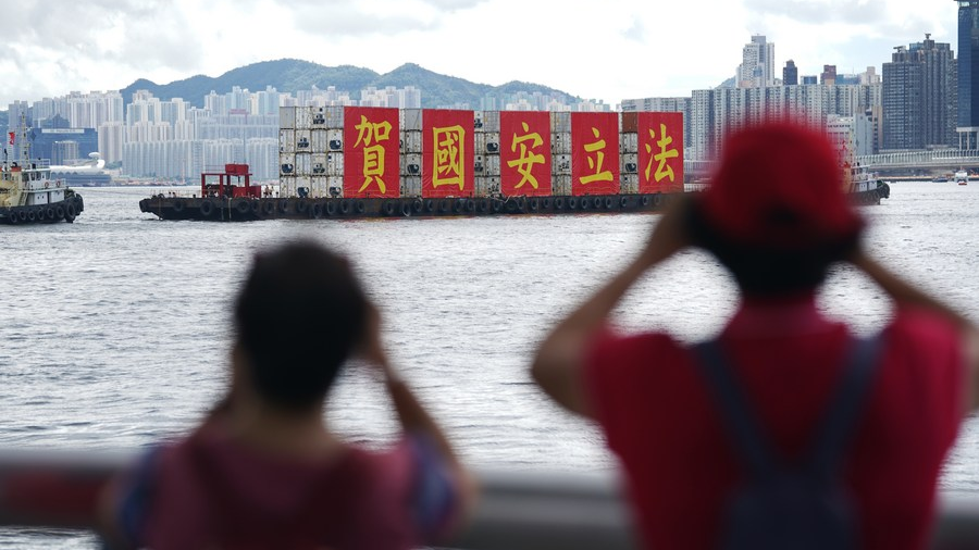 A ship carrying the slogan 