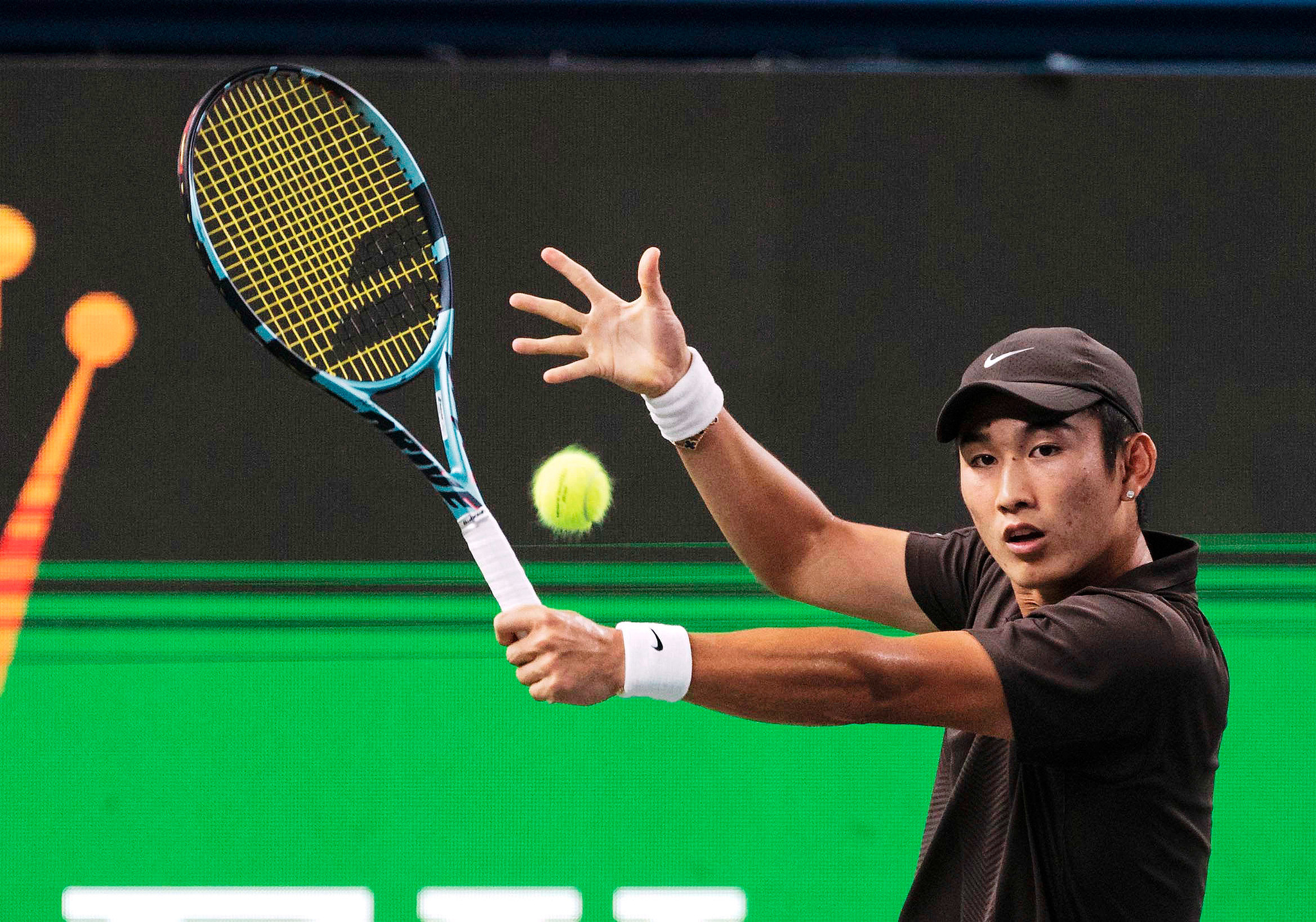 Shang Juncheng of China hits a shot against Karen Khachanov of Russia in a men's singles second round match at the ATP Shanghai Masters in east China's Shanghai Municipality, October 4, 2025. /VCG
