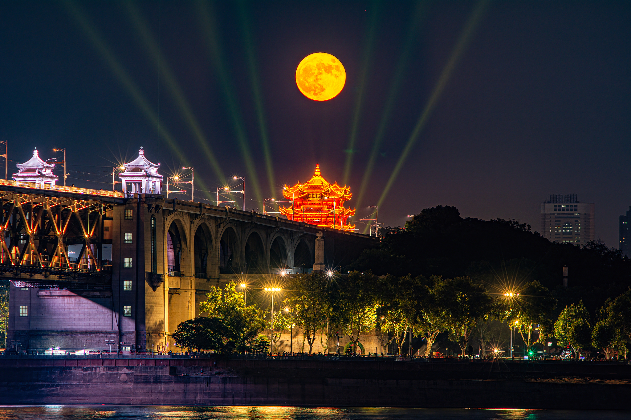 A supermoon is pictured over the Yellow Crane Tower in Wuhan, Hubei Province. /VCG