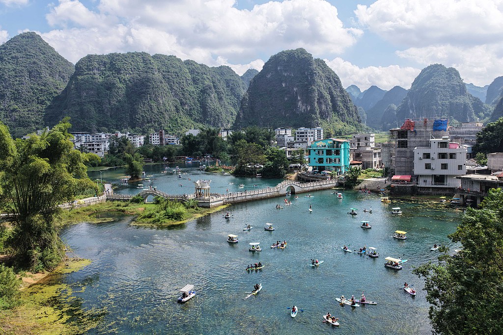 Tourists boat on a lake at a karst landform scenic spot in Guangxi Zhuang Autonomous Region on October 3, 2025. /VCG
