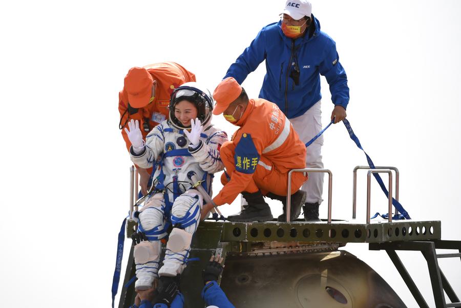 Chinese Astronaut Wang Yaping steps out of the return capsule of the Shenzhou-13 spaceship at the Dongfeng landing site in north China's Inner Mongolia Autonomous Region, April 16, 2022. /Xinhua