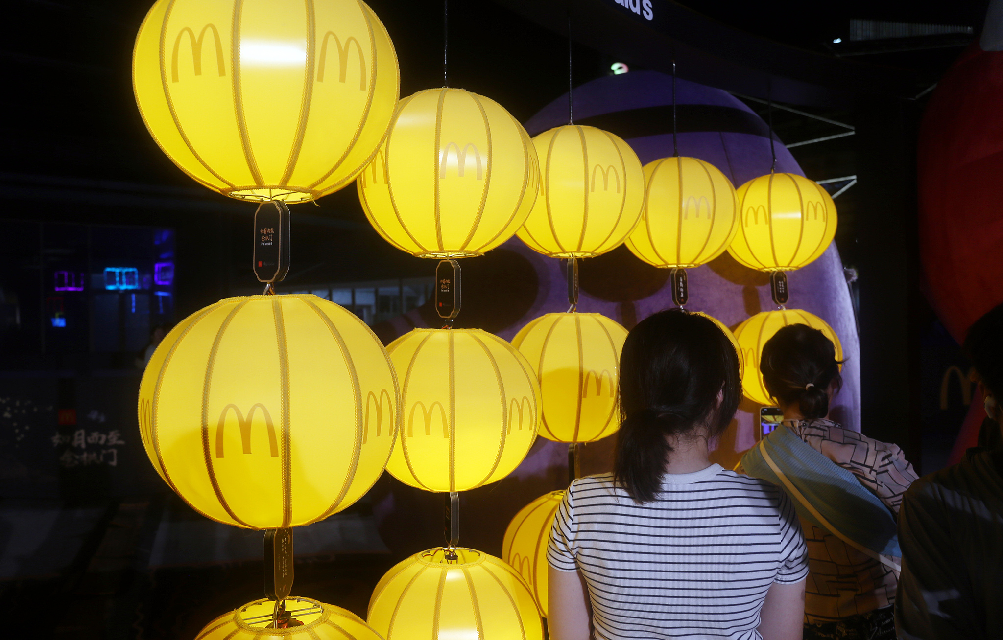 Lanterns featuring the McDonald's logo at the Mid-Autumn market co-hosted by the two brands, held at Xuhui Riverside Plaza, Shanghai, China, September 22, 2025. /VCG