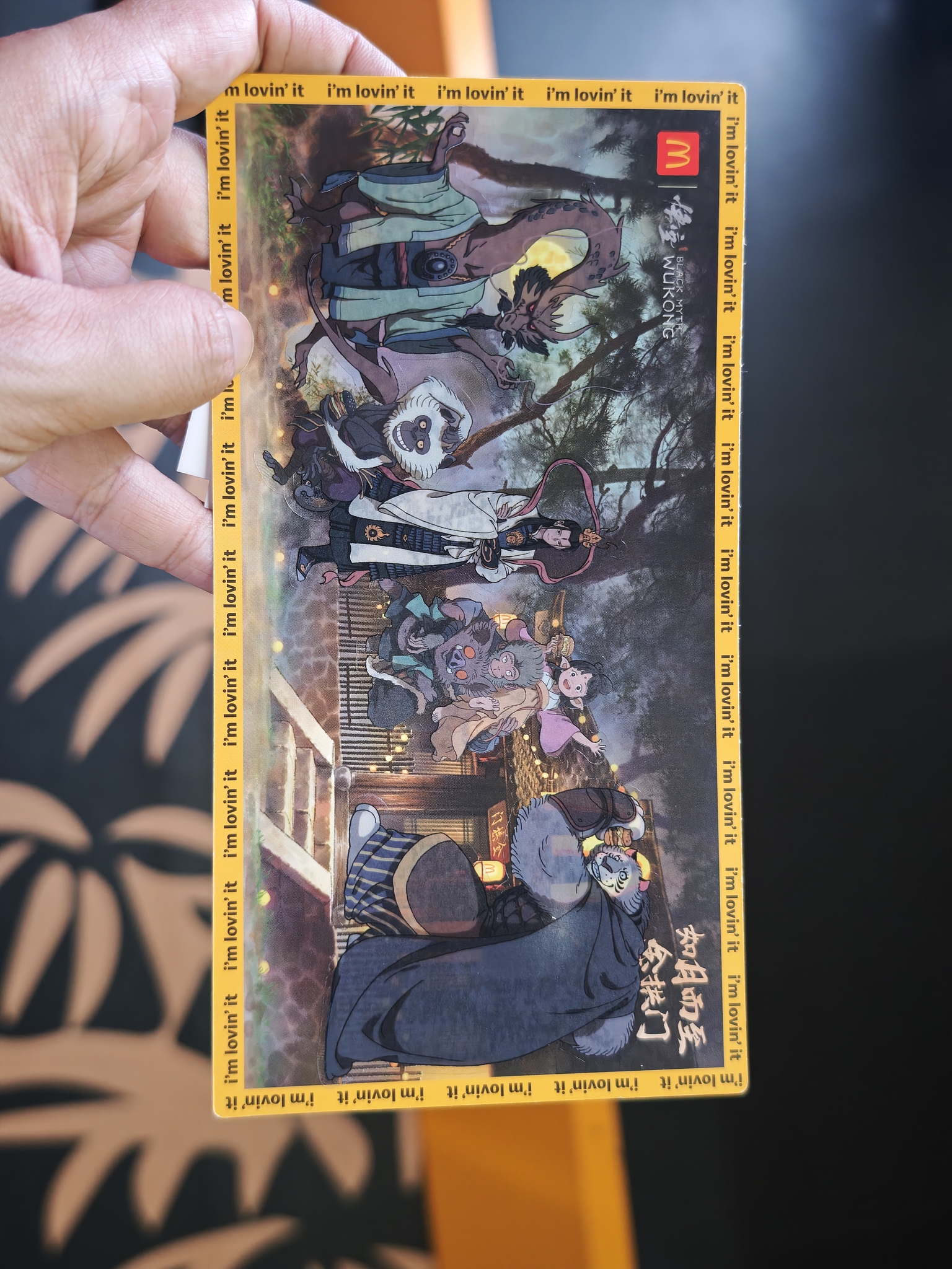 A male holds a complimentary item for the co-branded set meal at the Mid-Autumn market co-hosted by the two brands, held at Xuhui Riverside Plaza, Shanghai, China, September 20, 2025. /VCG