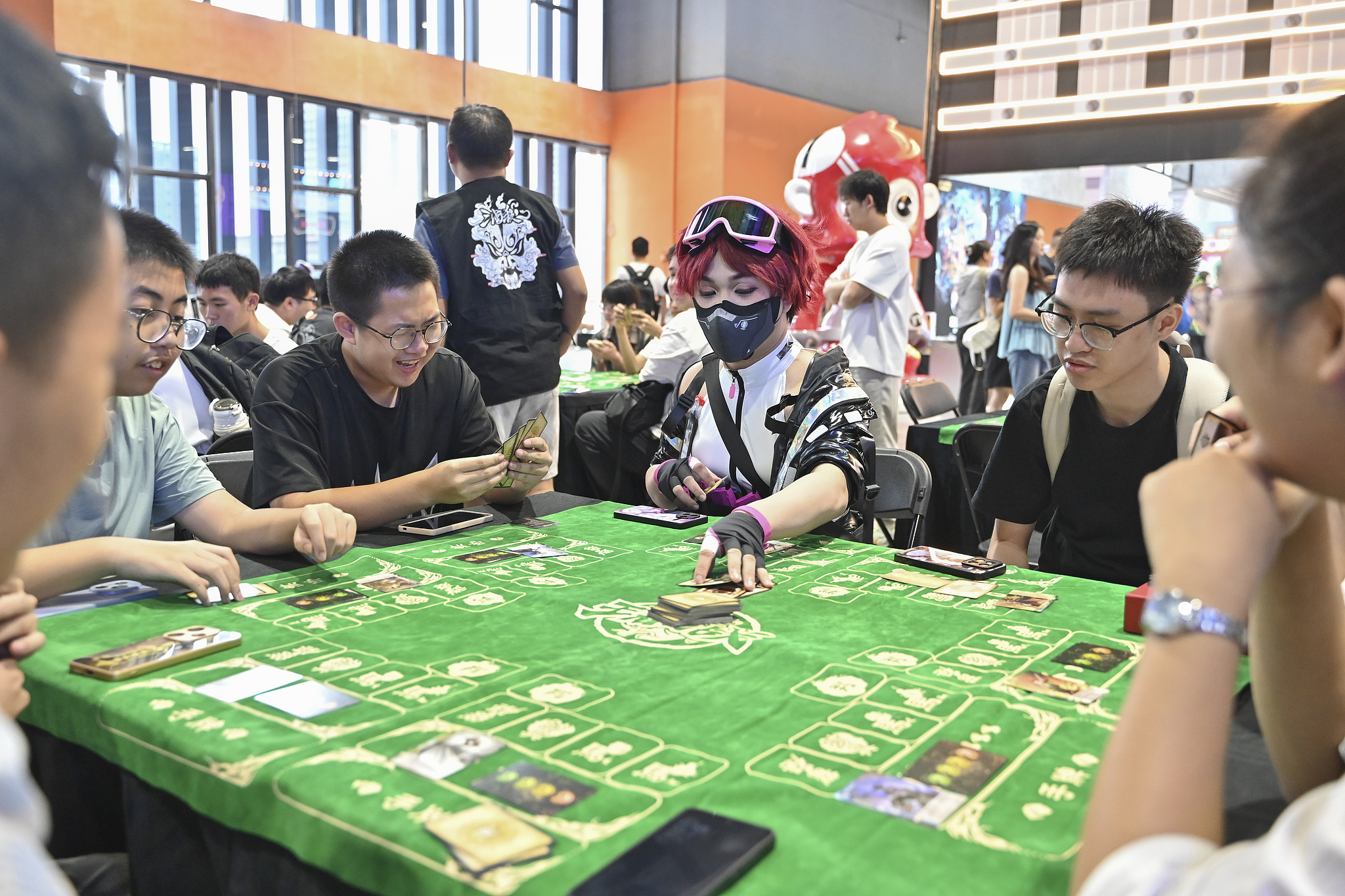 A few people play Legends of the Three Kingdoms (Sanguosha), a Chinese card game based on the Three Kingdoms period of China at the CICF×AGF Animation and Game Festival in Guangzhou, south China's Guangdong Province, October 2, 2025. /CFP